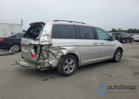 2009 Honda Odyssey Touring z USA, uszkodzony, nr VIN 5FNRL389X9B003277